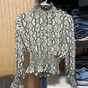 Thin Snakeskin designed long sleeved blouse with cuffed sleeves and neckline